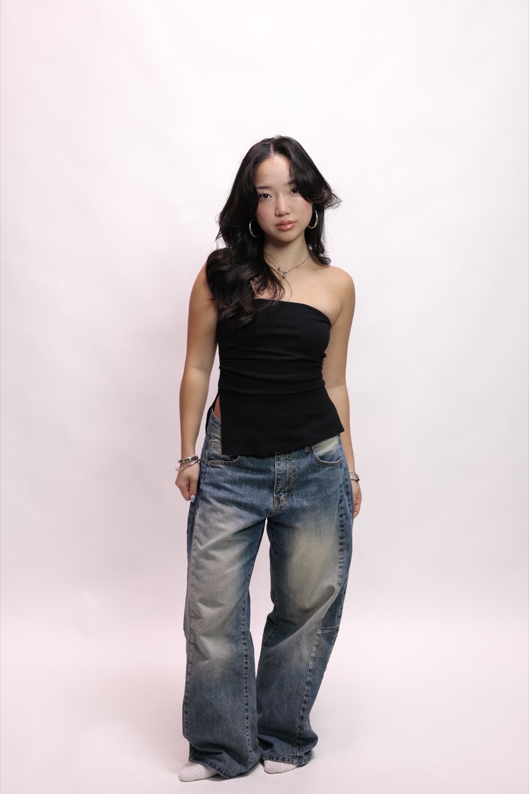 Full-length studio portrait in jeans