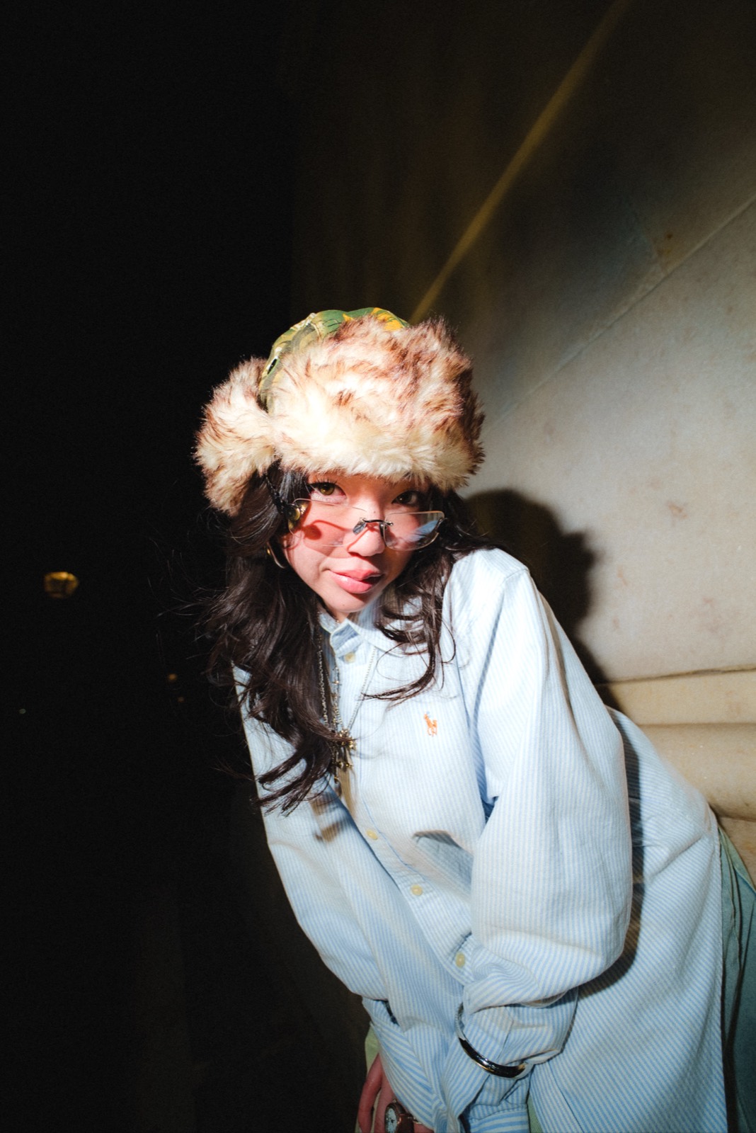 Night flash, fur hat and blue jacket
