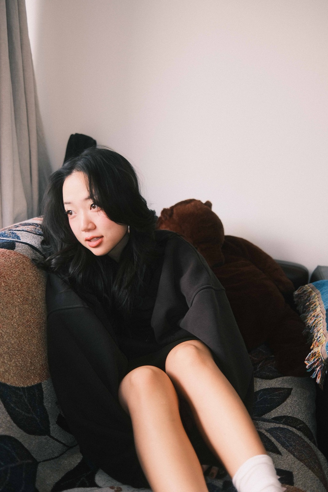 Yoonji sitting on a couch